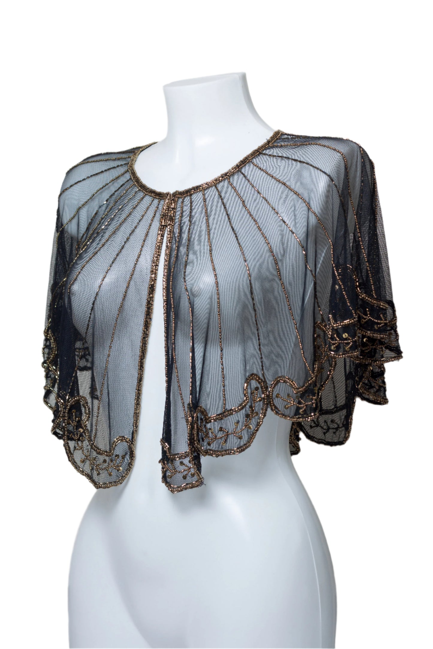A black capelet with silver sequins and embroidery, displayed on a mannequin.