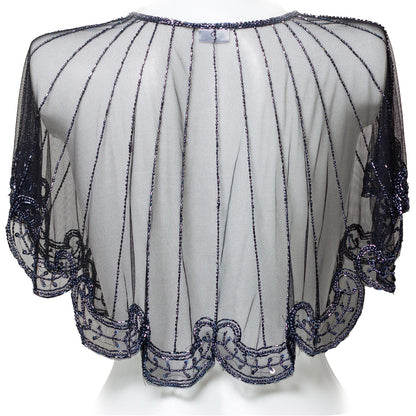 White blouse with black beaded details on a white background