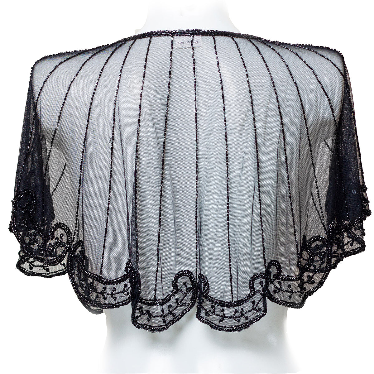 Black lace shrug on a mannequin against a white background